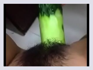 Superhot teen plays with a cucumber as a dildo