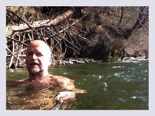 Naked uncut bear chilling in the river - outdoor, natural, mature