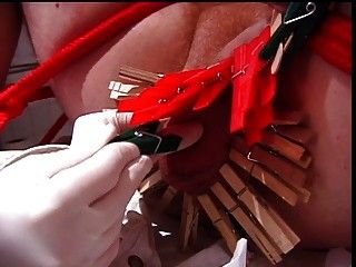 Male submissive gets clothespins attached to penis