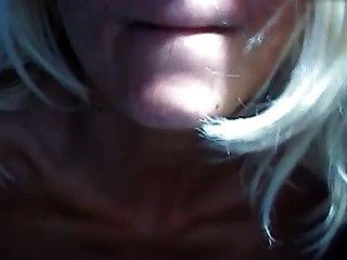 Milf with natural tits plays with them and hairy crotch