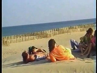 Two couples for voyeurs on the beach