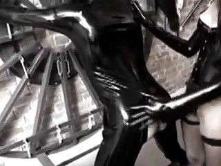 Latex Dominatrix with strap on part 1