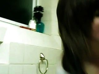 Busty girl sucking in the bathroom