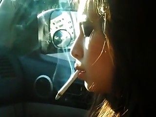 Woman smoking in car 2
