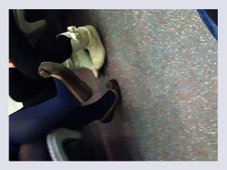 Blue pantyhose and flats on train