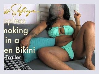 Topless Smoking in a Green Bikini   Trailer