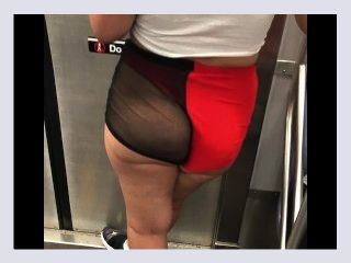 Wife in mesh see through shorts walking around train station