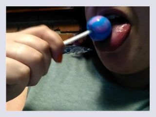 Chubby Gal Sucks a Lollipop While Watching TV