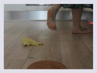 Barefooted while cooking and cleaning the kitchenning the 