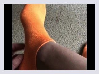 Self tickling on orange socks