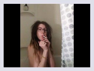 Sexy dread head smoking in the shower