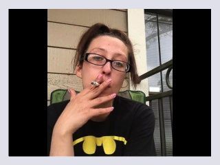 Nerdy Goddess D Smoking Cork Tip 100 Cigarette in Batman Shirt and Glasses