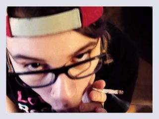 Fat glassed nerdy emo girl uses a vibrator to satisfy her pussy, while smoking a cig