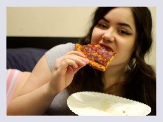 Bored Girl Chews On Pizza