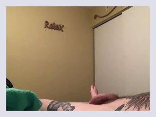 Tattooed guy jacks off to porn