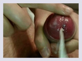 Playing with precum and cum during a handjob 