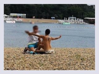 Milf Lilly naked on public beach got oil massage from stranger