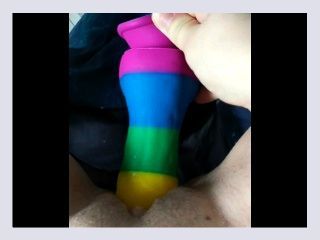 Cumming on a rainbow dildo in bed