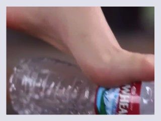 Beautiful girl Foot crush bottle with dirty feet dfd