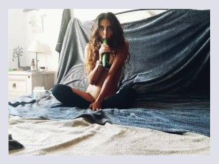 Girl plays with cucumber