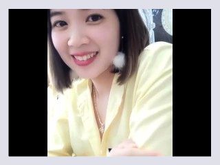 Vietnamese female staff shows off her chest