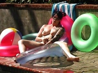 Horny MILF squirting by the pool