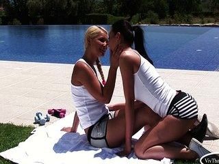 Lesbian babes exercising by the pool