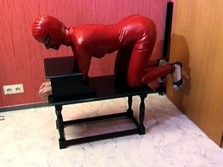 Red bondage suit sub girl