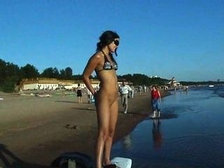Nudist girls have fun with each other at the beach part 1