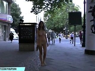 Naughty naked babe has fun on public streets